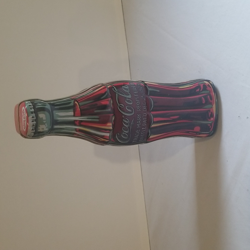 Coca cola tin 9 inches tall 3 inches wide